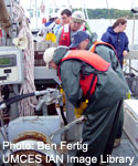 collecting samples from boat